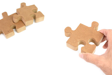 Wooden puzzle, jigsaw lie on white background.