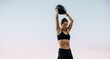 © Jacob Lund - Muscular female athlete exercising with medicine ball