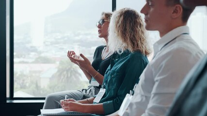 Wall Mural - Businesswoman sharing her views with the presenter during a business conference. Interactive business seminar in progress.
