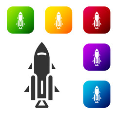 Wall Mural - Black Rocket ship with fire icon isolated on white background. Space travel. Set icons in color square buttons. Vector.