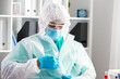 © fotofabrika - Male doctor in protective medical uniform in clinic