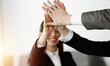© Iryna - Unknown business people group joining hands in sunny office. Businessmen and women making circle with their hands as a team, close-up. Success concept