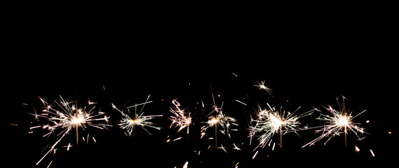 Sparkler overlay against black background. Festive, new years eve image. 