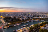 Fototapeta Most - Aerial view of Paris and the Seine River at sunset