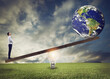 © alphaspirit - Businessman uses a lightbulb ad lever to lift the World. Earth provided by Nasa.