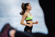 © Georgii - Running marathon athletic girl, female jogging outdoors on group workout, close up photography