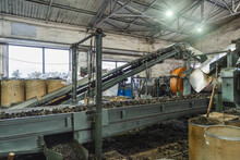 Rubber Recycling Processing Factory On Special Industrial Equipment And Conveyor Line With Cut Used Car Tires. Recycling Waste, Saving Environment From Pollution.