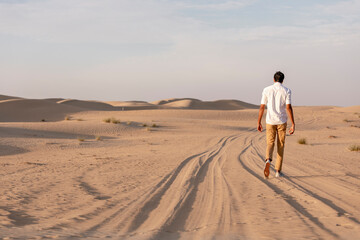 a man in a desert at surise