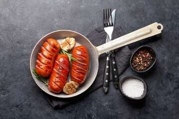 Canvas Print - Hot grilled sausages in a frying pan