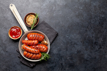 Canvas Print - Hot grilled sausages in a frying pan