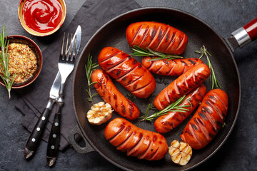 Canvas Print - Hot grilled sausages in a frying pan