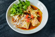 © zhinna - Boiled meat dumplings with fresh parsley, soy sauce and sesame seeds. Delicious meal for dinner.