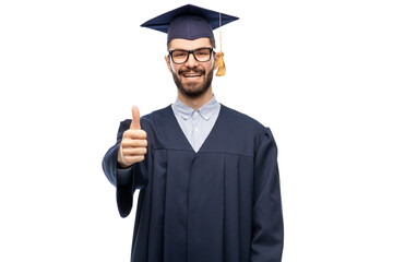 Poster - education, graduation and people concept - happy smiling male graduate student in mortar board and bachelor gown showing thumbs up over grey background