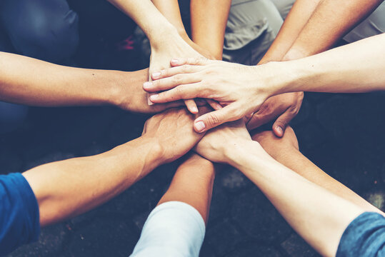 Solidarity unite people hands together community teamwork. Hands of spirit team working together outdoor. Unity strong handshake with people or agreement of feeling or happy diverse education action