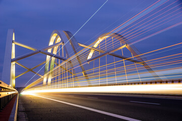 Wall Mural - Highway speed traffic. Light trails effect at night