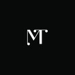 M T letter logo creative design on black color background. mt monogram