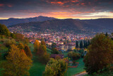 Fototapeta Las - Beautiful sunrise over the Bergamo city in northern Italy