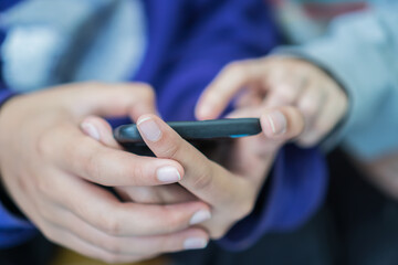 online education at home, hands female students doing school homework by smartphone apps studying in