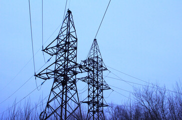 Power lines with wires on sky background