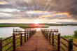 Sunset over a small pier in wetland area of the Isimangaliso National Park in KwaZulu-Natal region of South Africa.	