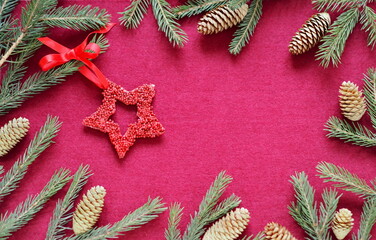 Wall Mural - New Year is congratulatory background with New Year is toys stars on fir branches. Red felt background. Place for text.