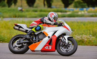 Wall Mural - Motorcycle practice leaning into a fast corner on track