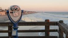 Metallic Stationary Observation Tower Viewer, Waterfront Old Binoculars, Oceanside Pier, California USA. Retro Vintage Beachfront Coin Operated Telescope, Sea Coast Outlook, Summer Ocean Beach Lookout