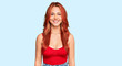 © Krakenimages.com - Young redhead woman wearing casual clothes with a happy and cool smile on face. lucky person.