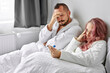 © alfa27 - couple is worried about the serious consequences, they get founded about pregnancy using test, sit unhappy sad on bed