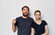 © SHOTPRIME STUDIO - young couple in black t-shirts fun emotions casual clothes studio