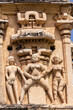 Hampi, Karnataka, India - November 4, 2013: Virupaksha Temple complex. Closeup of Sexual explicit nude beige stone statues on south side of east Gopuram. 