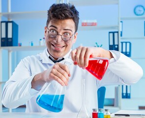 Funny mad chemist working in a laboratory