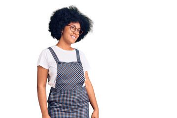 Sticker - Young african american girl wearing casual clothes looking away to side with smile on face, natural expression. laughing confident.