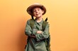 © Krakenimages.com - Cute blond kid wearing explorer hat and backpack happy face smiling with crossed arms looking at the camera. positive person.