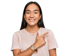 Poster - Young asian woman wearing casual clothes cheerful with a smile of face pointing with hand and finger up to the side with happy and natural expression on face