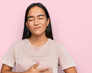 Poster - Young asian woman wearing casual clothes with hand on stomach because indigestion, painful illness feeling unwell. ache concept.