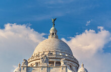 The Iconic Victoria Memorial Of Kolkata In A Summer Day. Visible A Metallic Fairy Figurine On Top Of The Building Dome, Which Once Used To Rotate In The Direction Of Wind.