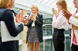 positive caucasian business woman celebrate winning with colleagues, diverse women clapping hands, congratulating