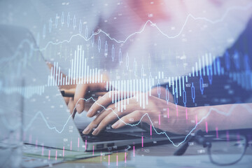 Fototapete - Multi exposure of woman hands typing on computer and financial graph hologram drawing. Stock market analysis concept.