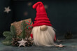Snow gnome or elf in a red cap. Christmas toy. Selective focus