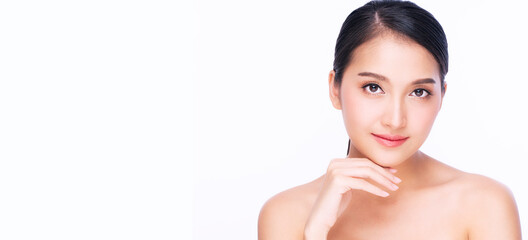 Beauty, cosmetics, healthy, treatment, skincare and spa concept. Asian young woman touching own face with clear fresh skin. Teenager with perfect treatment skin over isolated white background.