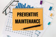 © Superzoom - Preventive Maintenance is written on a notepad on office desk