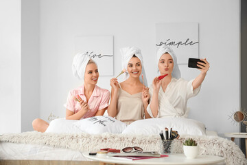 Poster - Beautiful young women taking selfie at pamper party