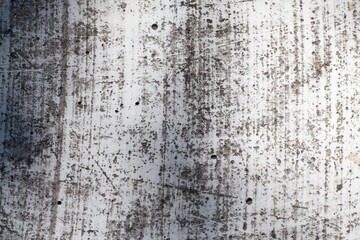 White scratched cement wall laying in the house