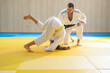 © Vesna - Judo master and young judo girl are training