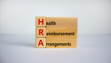 Health Reimbursement Arrangement Symbol. Wooden Cubes And Blocks With Words 'HRA, Health Reimbursement Arrangement'. Beautiful White Background, Copy Space. Business And HRA Concept.