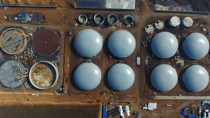 Wall Mural - Process of building plant for sustainable production of biofuel. Bio gas factory. Modern plant. Aerial view on the modern biofuel factory. View from above.