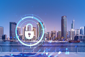 Skyscrapers of Dubai business downtown. International hub of trading and financial services. Lock icon hologram, concept of datum security. Double exposure. Dubai Canal waterfront.