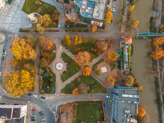 Wall Mural - A drone view of the historic city with the market square, churches and the town hall in Opole during sunset. Autumn in Silesia - Poland.