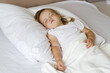 © Rodica - Blonde sweetest  toddler girl sleeping peacefully in white bed. Daytime sleep of the child. Bedtime